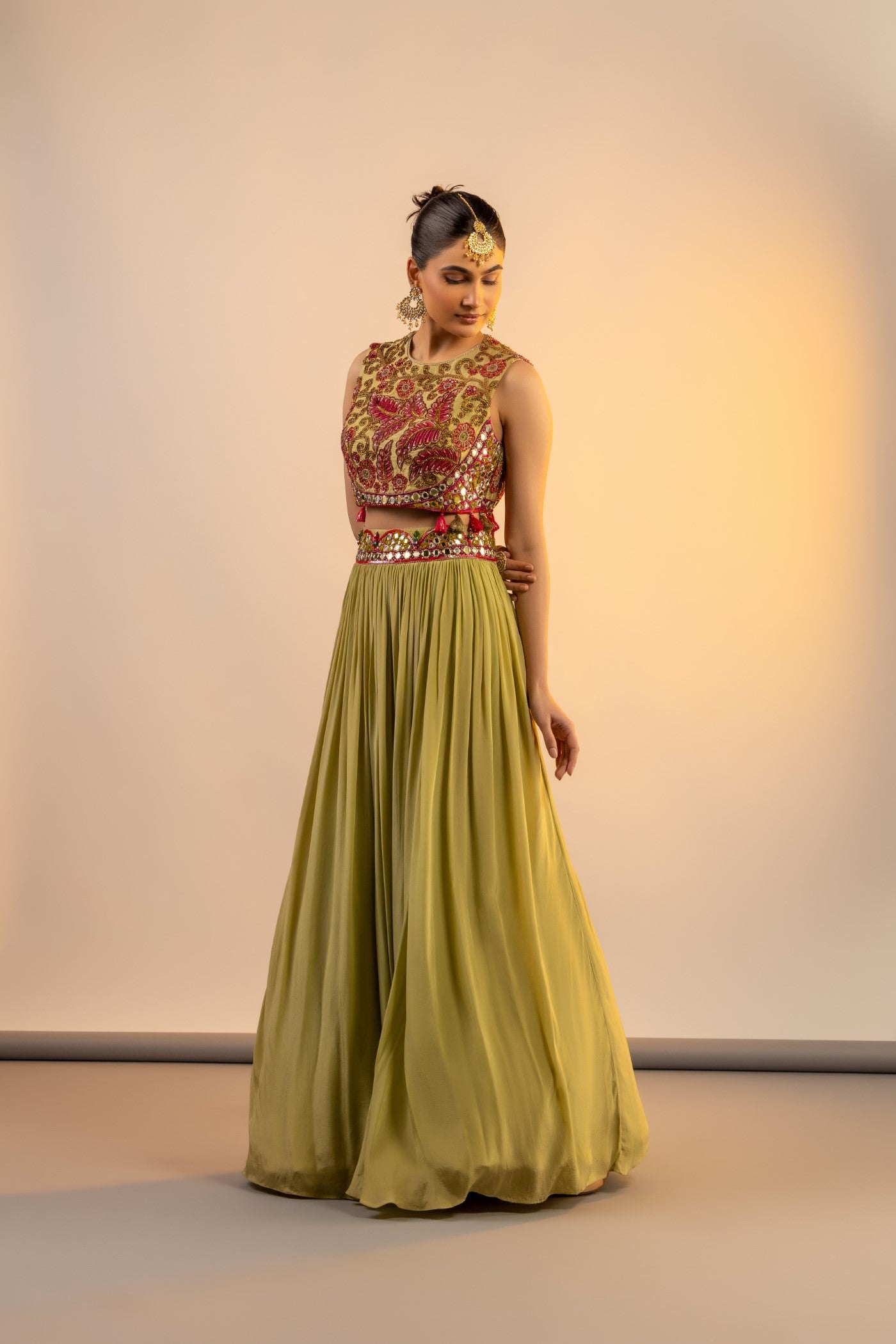 Pista green crop top and skirt with multi colour thread work