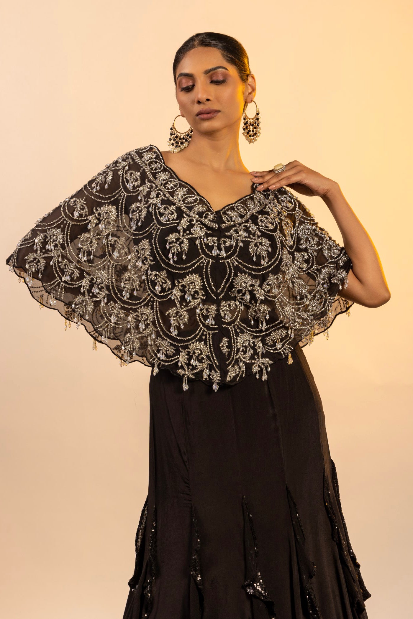 Black crop top and skirt with poncho