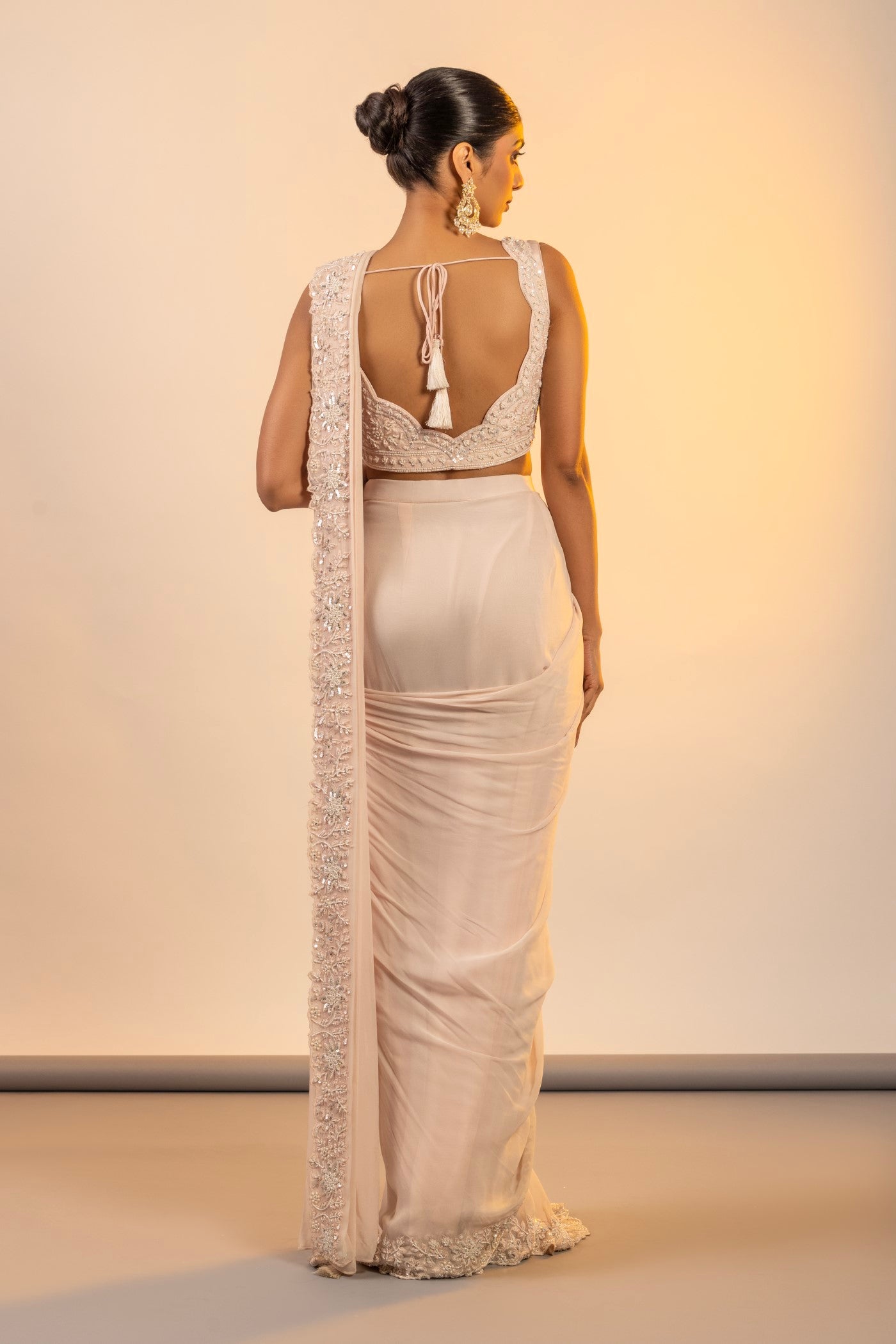 Blush pink drape saree with cutdana and sequins