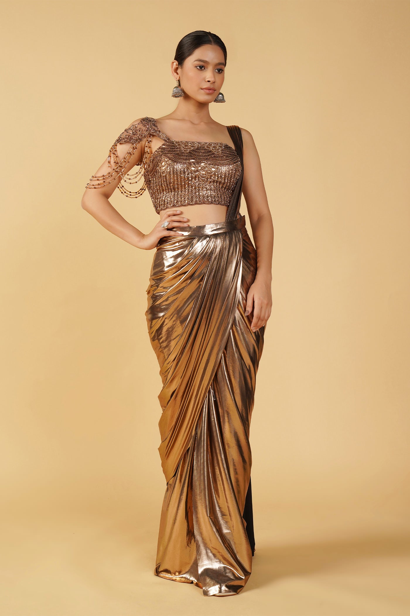 Sukhmani Gambhir in Gold metallic drape saree