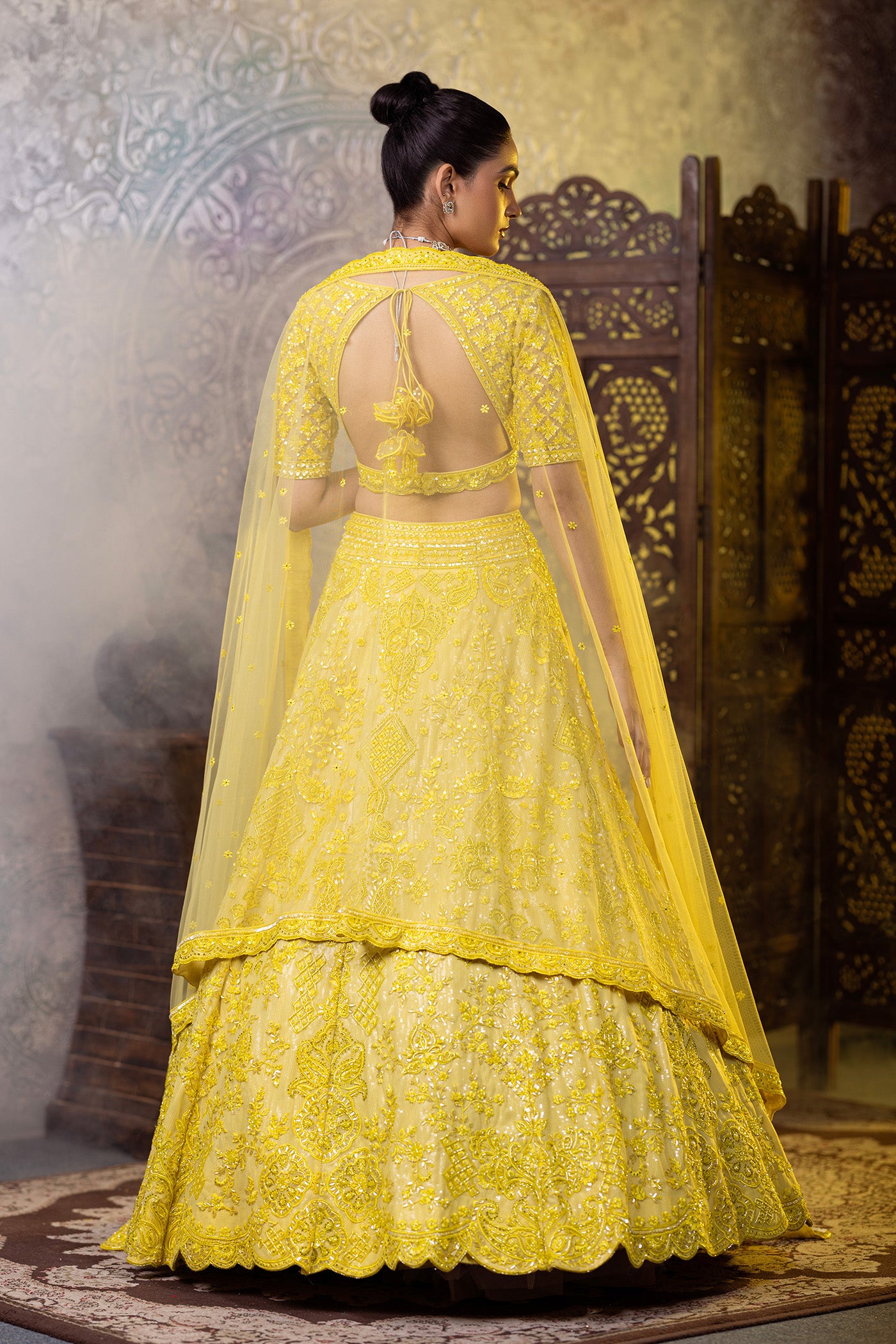 Yellow lehenga choli with sequins work