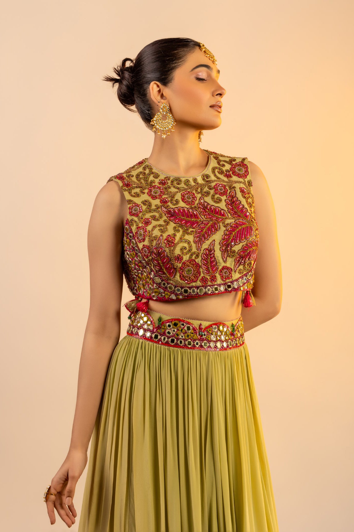 Pista green crop top and skirt with multi colour thread work