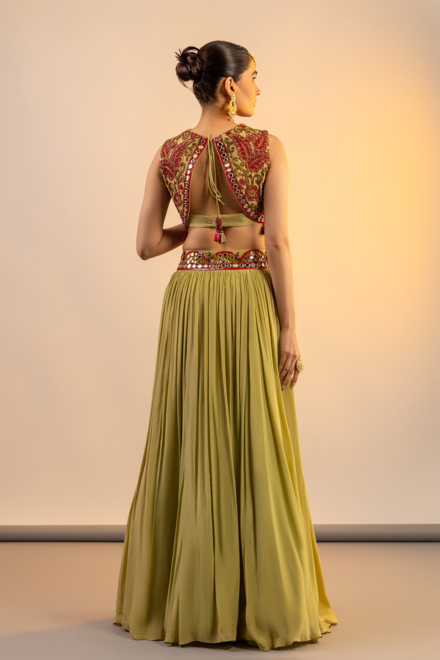 Pista green crop top and skirt with multi colour thread work