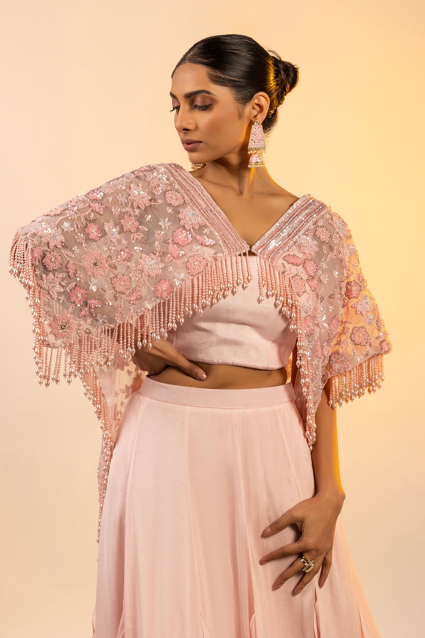 Pink crop top and skirt with poncho