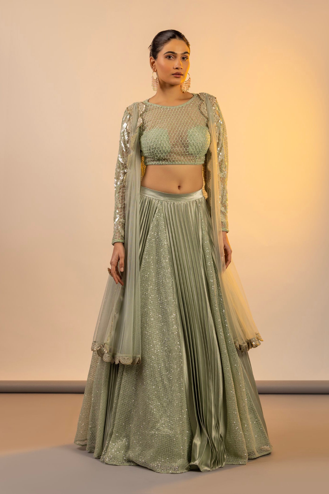 Green Heavy Lehenga With A Crop Top In Long Cape Embroidered Sleeves –  Akashi designer studio