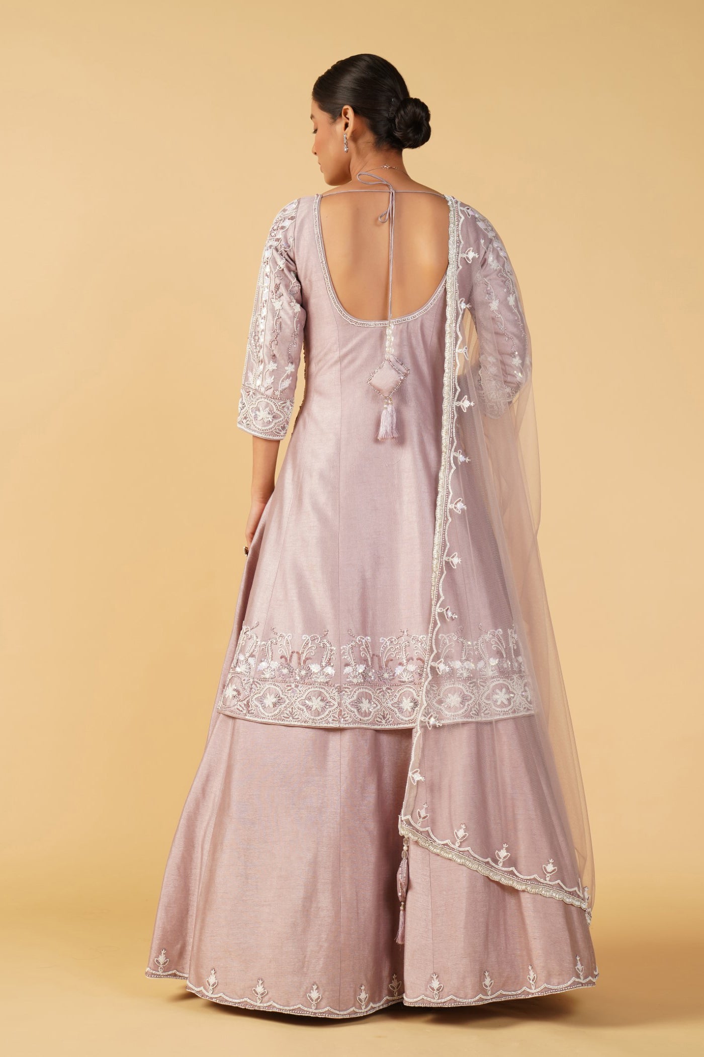 Pastel pink raw silk short kurti with poth and cutdana work